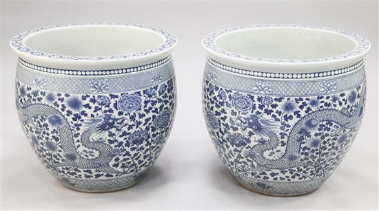 A pair of massive Chinese blue and white jardinieres or fish bowls, of recent manufacture, diam.62.5cm